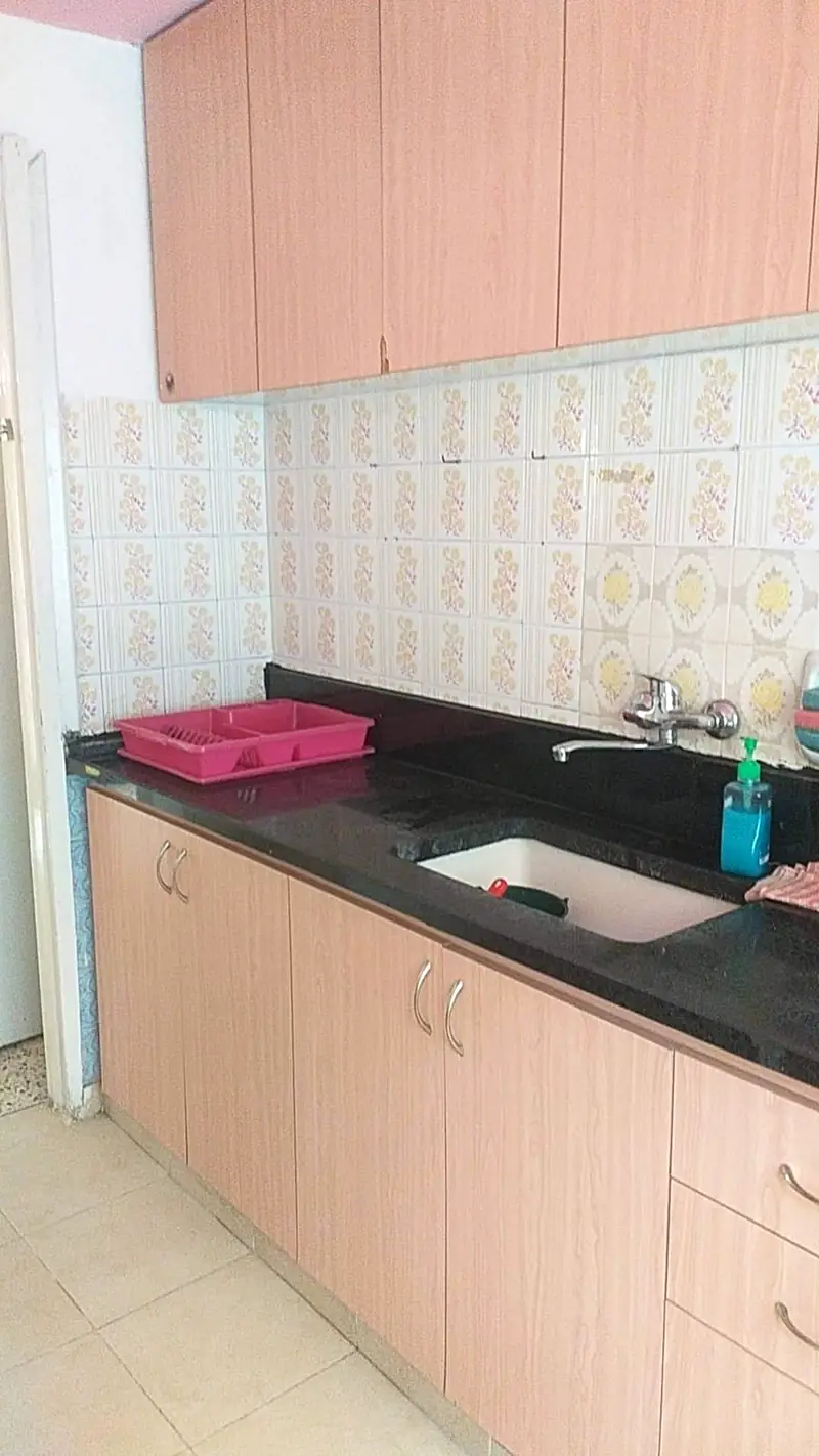 The kitchen counter with patterned tiles