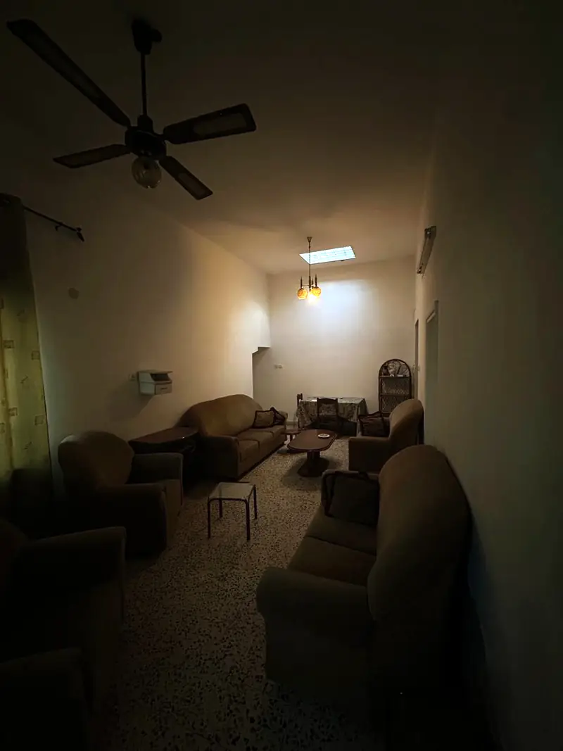 The living room in the evening, lamps on